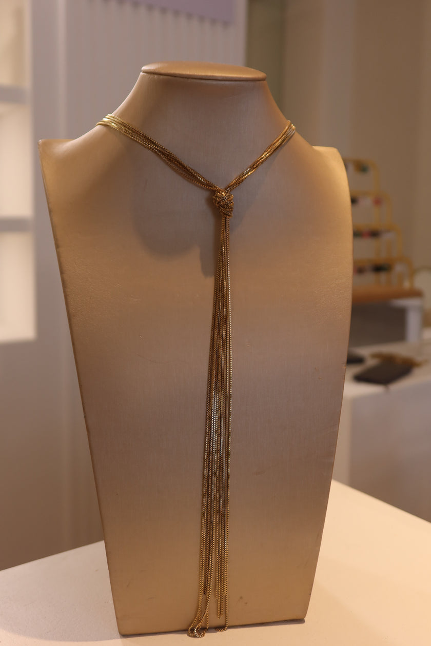 Corbatero nudo dorado