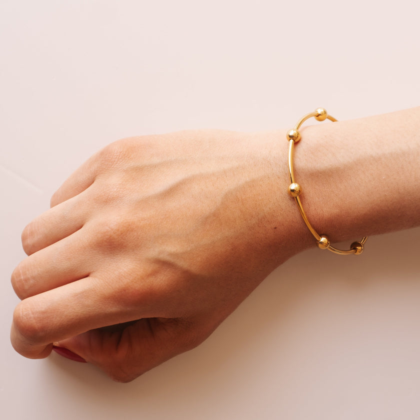 Pulsera Rígida Bolitas Dorada